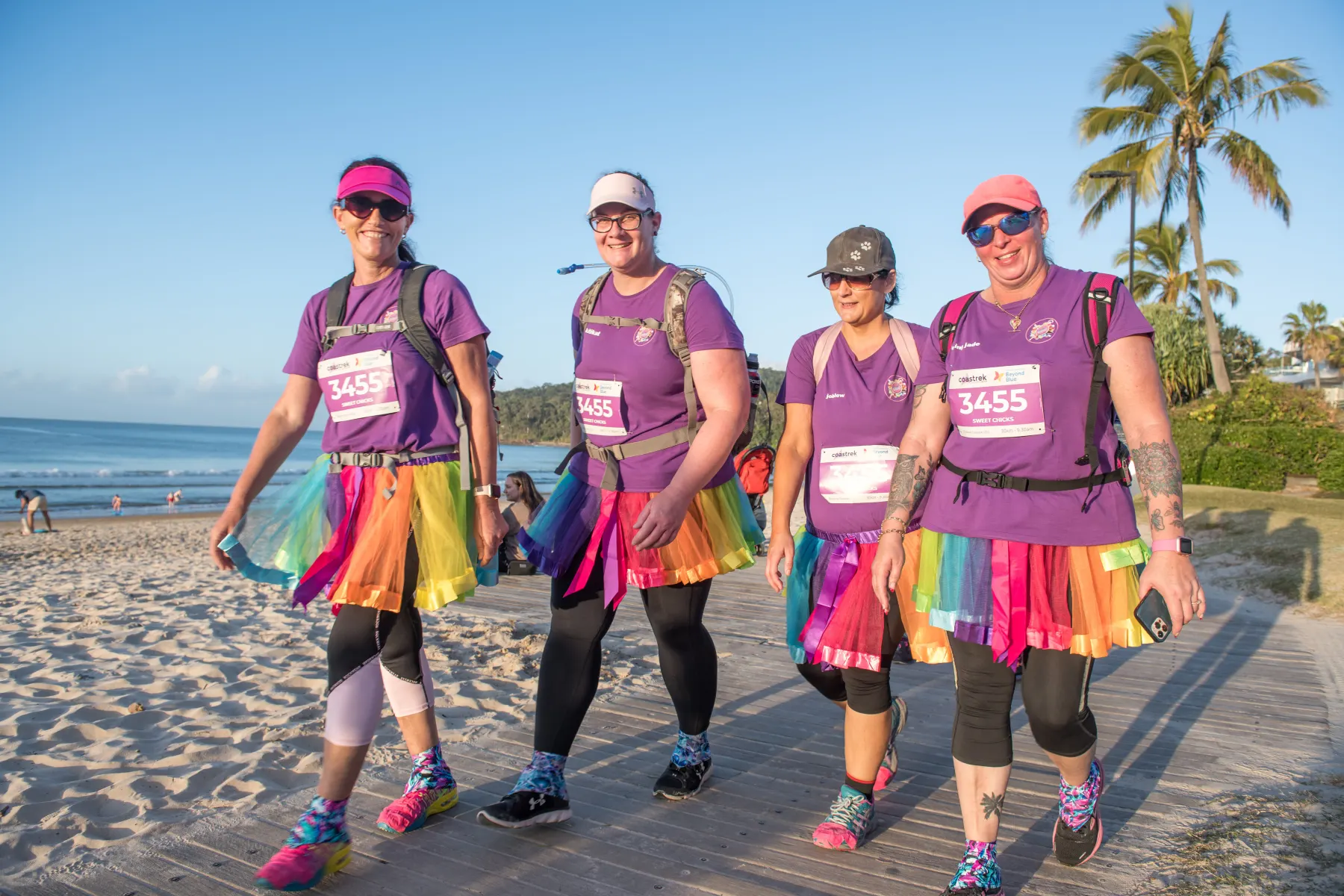 Community walkers enjoying an active morning by the Sunshine Coast beach