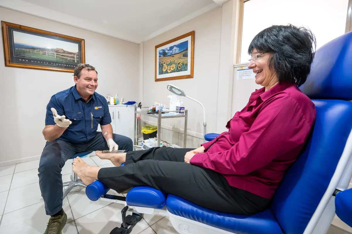 Cooroy podiatrist discussing foot care with a patient
